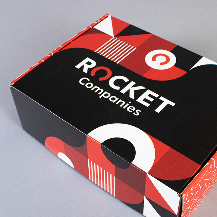 square image of a cardboard box with a white and red pattern on it, and the words "Rocket companies" on the top